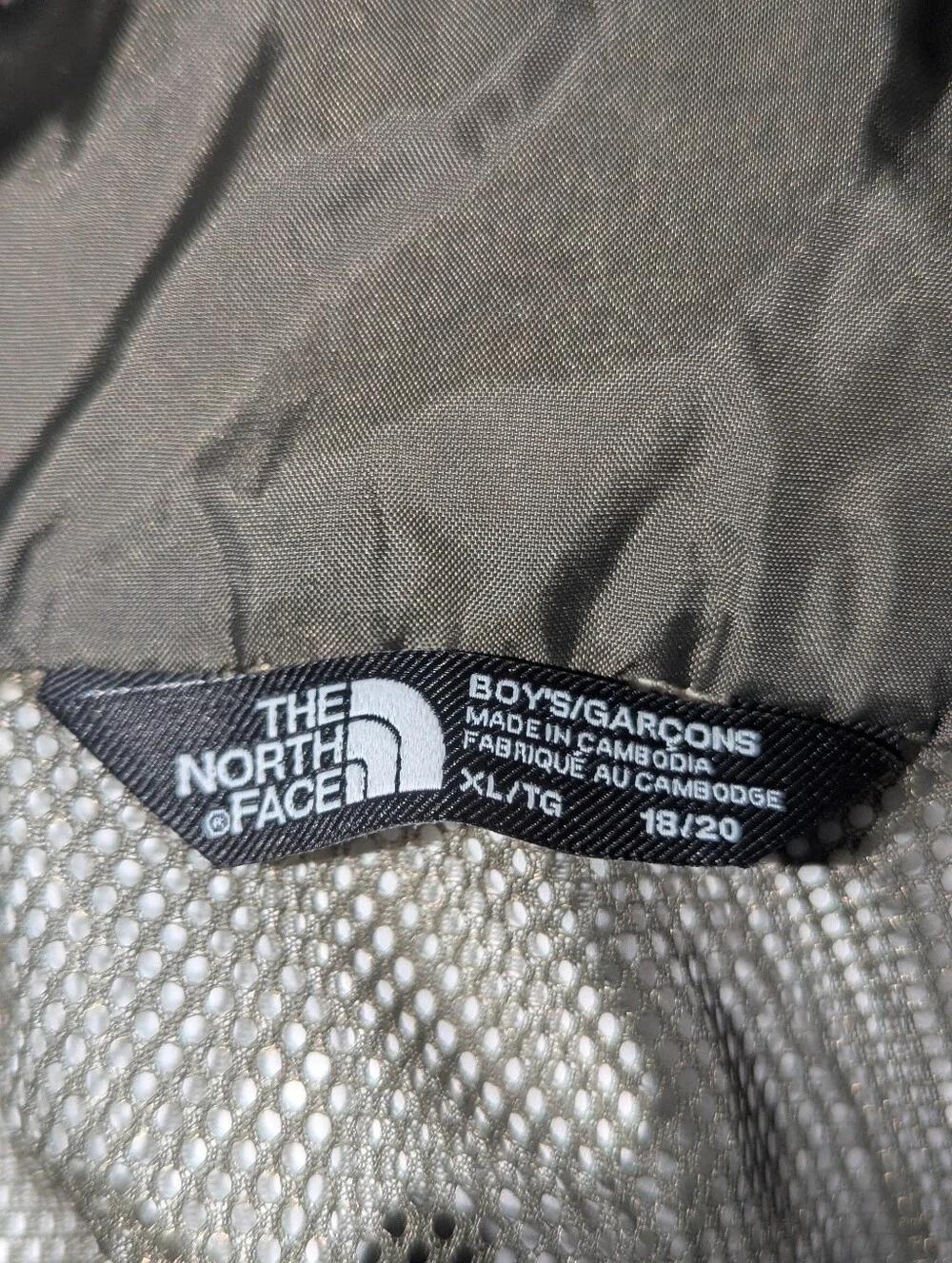 The North Face Kids Hooded Raincoat in Black and Green Camo